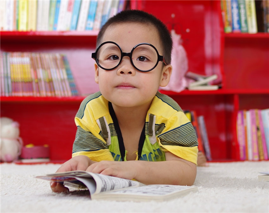 boy with glasses and books